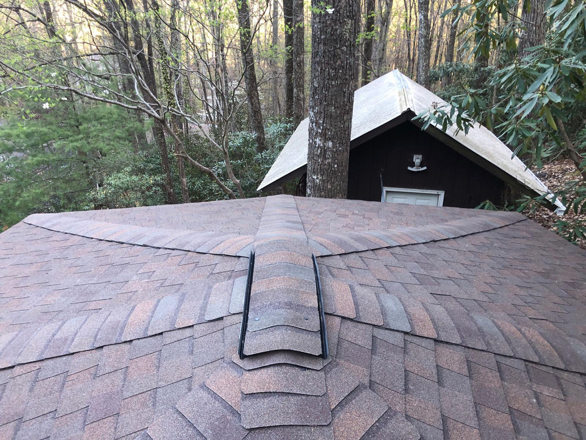 Elevate the beauty and protection of your Black Mountain, NC rotunda home with our premium asphalt shingle roof replacement services. Our skilled roofing professionals specialize in preserving the unique architectural features of rotunda homes while delivering exceptional durability and performance.

With meticulous attention to detail and the use of top-quality materials, we ensure a seamless roof replacement process that enhances both aesthetics and functionality. Safeguard your home against the unpredictable North Carolina weather with our reliable asphalt shingles, designed to withstand wind, rain, and UV exposure.

Our experienced team is committed to providing a stress-free experience, minimizing disruptions to your daily life. We take pride in delivering exceptional craftsmanship, leaving you with a beautiful, long-lasting roof that complements the distinct character of your rotunda home.

Trust our locally based experts for your asphalt shingle roof replacement needs in Black Mountain, NC. Contact us today to schedule a personalized consultation and take the first step towards enhancing your rotunda home's curb appeal and protection.