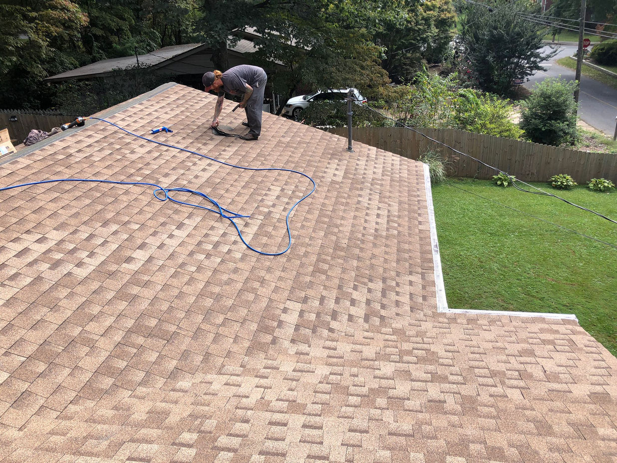 Enhance your Asheville, NC home with a professional asphalt architectural shingle roof replacement and expert chimney flashing services. Our skilled team is dedicated to providing exceptional craftsmanship and superior protection for your house.

With our asphalt architectural shingles, you'll enjoy a stunning roof that adds curb appeal while withstanding the elements. Our precise installation process ensures a seamless fit, guaranteeing both beauty and durability for your Asheville home.

In addition to roof replacement, our chimney flashing experts ensure a watertight seal, preventing leaks and water damage. Trust our experienced team to safeguard your home against moisture intrusion and maintain the structural integrity of your chimney.
We prioritize a smooth and stress-free experience for our customers, delivering unmatched quality and professionalism from start to finish. Increase your home's value and comfort with our reliable roofing and chimney services in Asheville, NC.
Contact us today to schedule a consultation and discover how our asphalt architectural shingle roof replacement and chimney flashing services can transform your home.