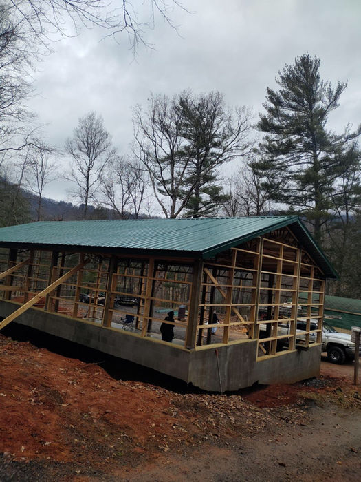 Professional installation of galvanized metal roof, fascia, and soffit on a house in Black Mountain, NC. Enhance your home's durability and aesthetics with our expert roofing services.