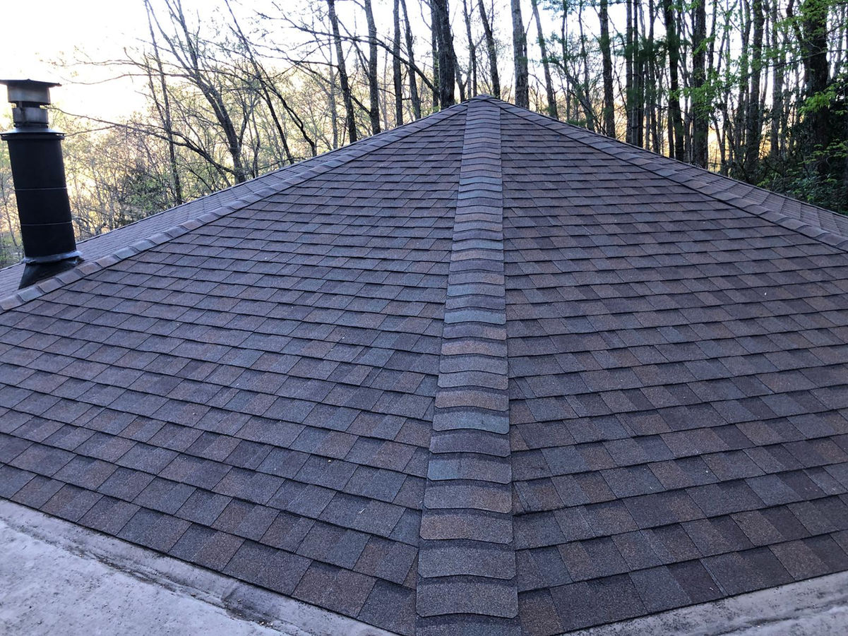 Elevate the beauty and protection of your Black Mountain, NC rotunda home with our premium asphalt shingle roof replacement services. Our skilled roofing professionals specialize in preserving the unique architectural features of rotunda homes while delivering exceptional durability and performance.

With meticulous attention to detail and the use of top-quality materials, we ensure a seamless roof replacement process that enhances both aesthetics and functionality. Safeguard your home against the unpredictable North Carolina weather with our reliable asphalt shingles, designed to withstand wind, rain, and UV exposure.

Our experienced team is committed to providing a stress-free experience, minimizing disruptions to your daily life. We take pride in delivering exceptional craftsmanship, leaving you with a beautiful, long-lasting roof that complements the distinct character of your rotunda home.

Trust our locally based experts for your asphalt shingle roof replacement needs in Black Mountain, NC. Contact us today to schedule a personalized consultation and take the first step towards enhancing your rotunda home's curb appeal and protection.
