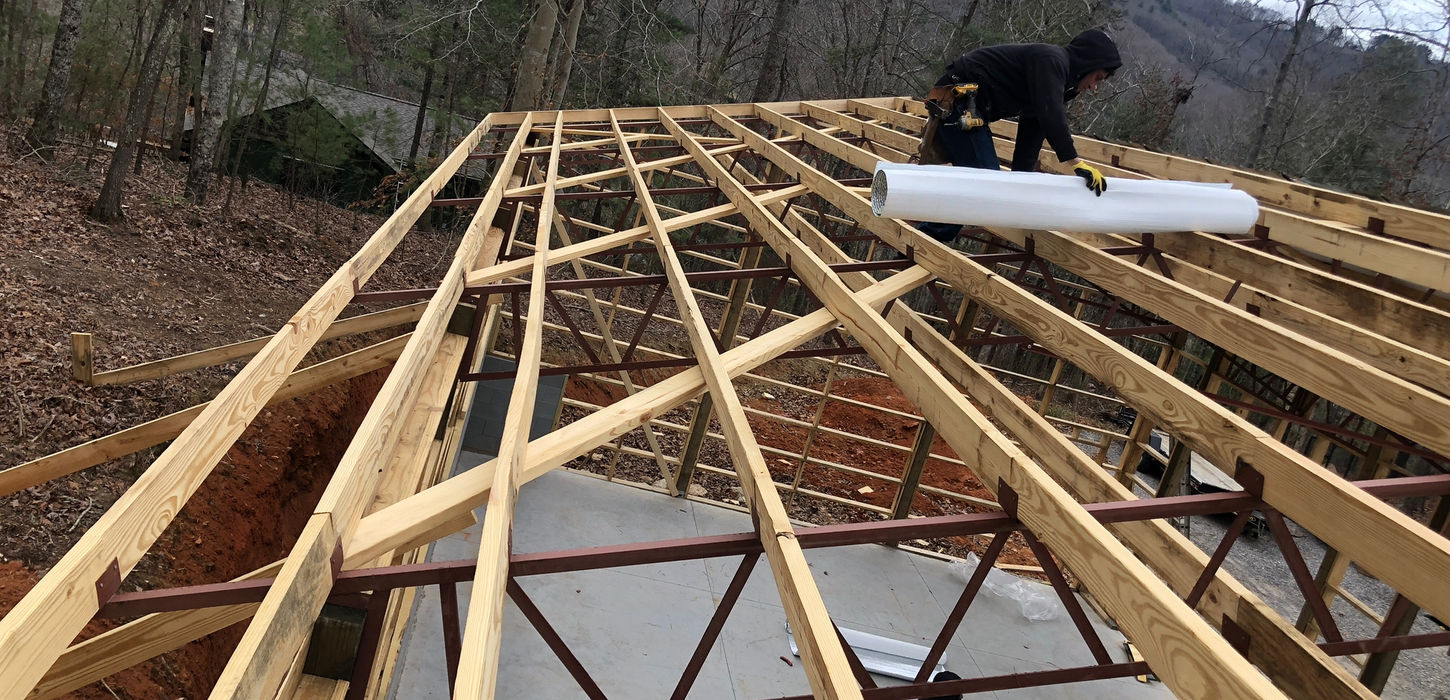 Professional installation of galvanized metal roof, fascia, and soffit on a house in Black Mountain, NC. Enhance your home's durability and aesthetics with our expert roofing services.