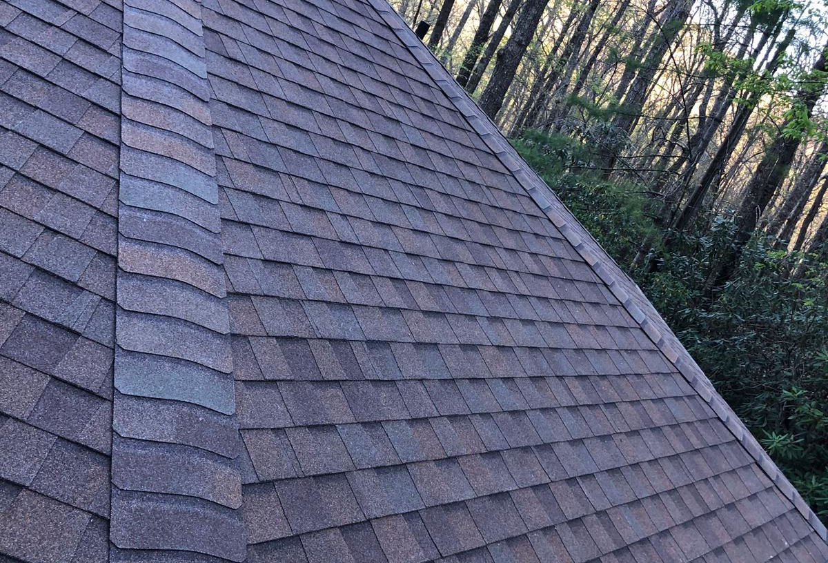 Elevate the beauty and protection of your Black Mountain, NC rotunda home with our premium asphalt shingle roof replacement services. Our skilled roofing professionals specialize in preserving the unique architectural features of rotunda homes while delivering exceptional durability and performance.

With meticulous attention to detail and the use of top-quality materials, we ensure a seamless roof replacement process that enhances both aesthetics and functionality. Safeguard your home against the unpredictable North Carolina weather with our reliable asphalt shingles, designed to withstand wind, rain, and UV exposure.

Our experienced team is committed to providing a stress-free experience, minimizing disruptions to your daily life. We take pride in delivering exceptional craftsmanship, leaving you with a beautiful, long-lasting roof that complements the distinct character of your rotunda home.

Trust our locally based experts for your asphalt shingle roof replacement needs in Black Mountain, NC. Contact us today to schedule a personalized consultation and take the first step towards enhancing your rotunda home's curb appeal and protection.