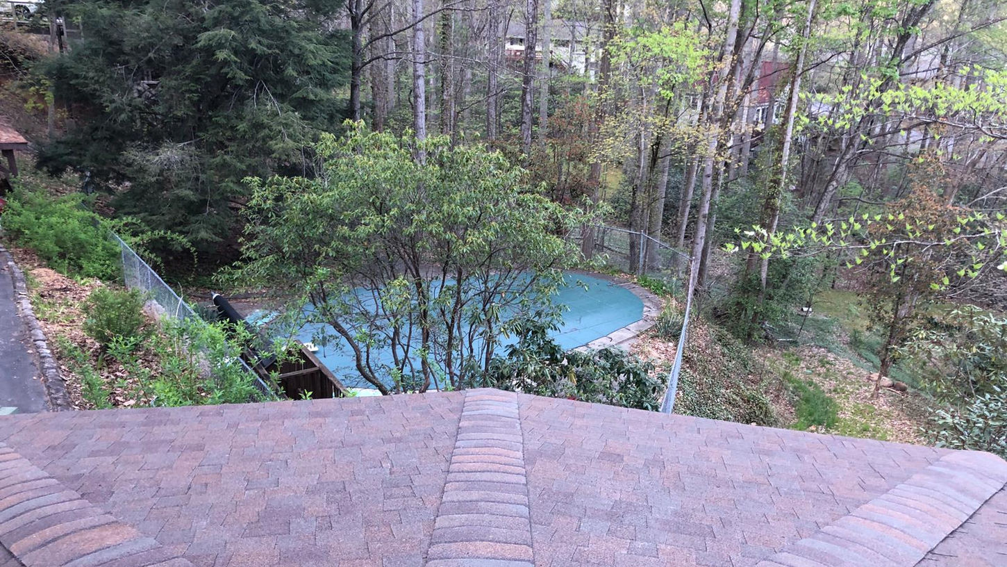 Elevate the beauty and protection of your Black Mountain, NC rotunda home with our premium asphalt shingle roof replacement services. Our skilled roofing professionals specialize in preserving the unique architectural features of rotunda homes while delivering exceptional durability and performance.

With meticulous attention to detail and the use of top-quality materials, we ensure a seamless roof replacement process that enhances both aesthetics and functionality. Safeguard your home against the unpredictable North Carolina weather with our reliable asphalt shingles, designed to withstand wind, rain, and UV exposure.

Our experienced team is committed to providing a stress-free experience, minimizing disruptions to your daily life. We take pride in delivering exceptional craftsmanship, leaving you with a beautiful, long-lasting roof that complements the distinct character of your rotunda home.

Trust our locally based experts for your asphalt shingle roof replacement needs in Black Mountain, NC. Contact us today to schedule a personalized consultation and take the first step towards enhancing your rotunda home's curb appeal and protection.