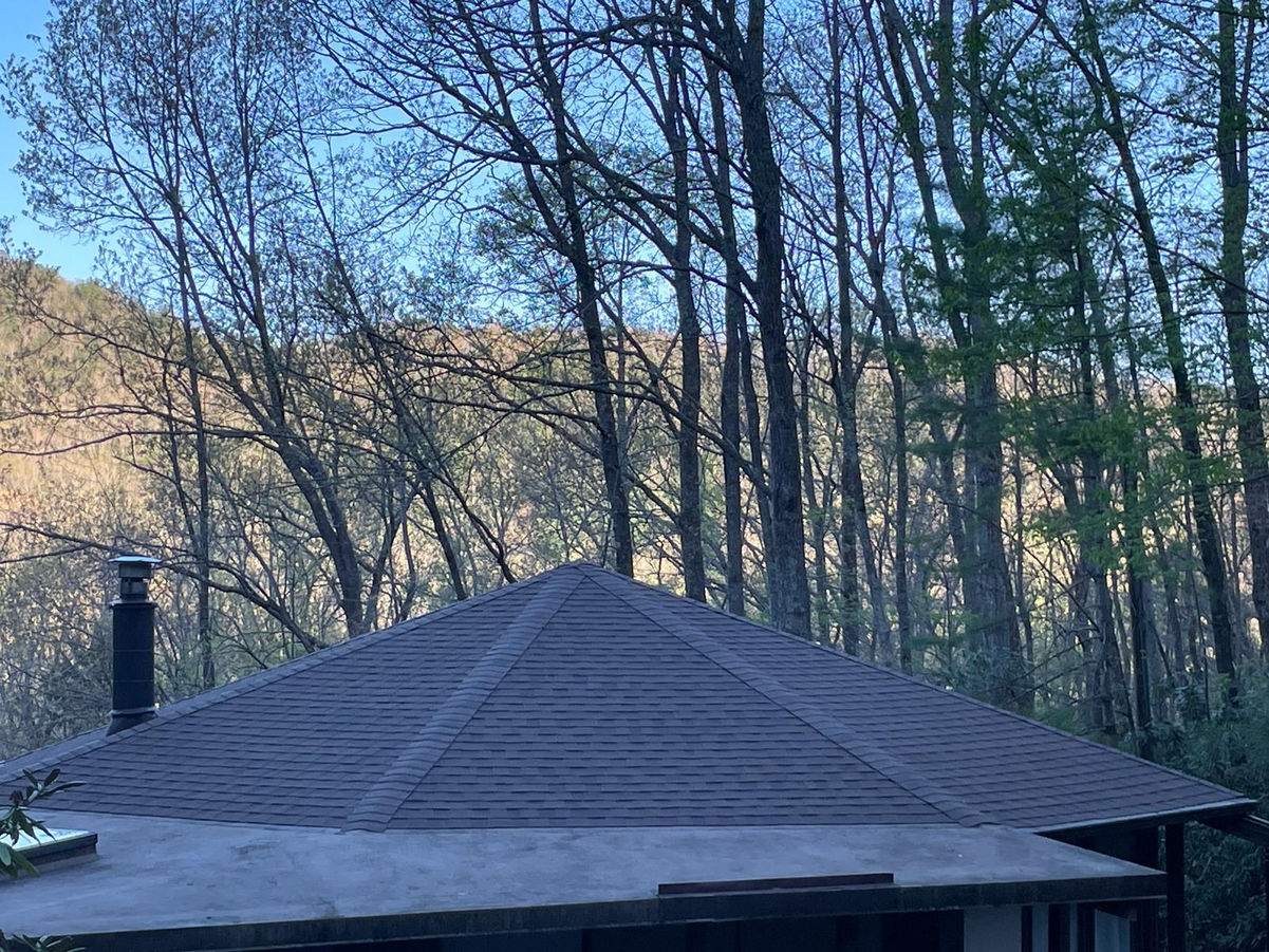Elevate the beauty and protection of your Black Mountain, NC rotunda home with our premium asphalt shingle roof replacement services. Our skilled roofing professionals specialize in preserving the unique architectural features of rotunda homes while delivering exceptional durability and performance.

With meticulous attention to detail and the use of top-quality materials, we ensure a seamless roof replacement process that enhances both aesthetics and functionality. Safeguard your home against the unpredictable North Carolina weather with our reliable asphalt shingles, designed to withstand wind, rain, and UV exposure.

Our experienced team is committed to providing a stress-free experience, minimizing disruptions to your daily life. We take pride in delivering exceptional craftsmanship, leaving you with a beautiful, long-lasting roof that complements the distinct character of your rotunda home.

Trust our locally based experts for your asphalt shingle roof replacement needs in Black Mountain, NC. Contact us today to schedule a personalized consultation and take the first step towards enhancing your rotunda home's curb appeal and protection.