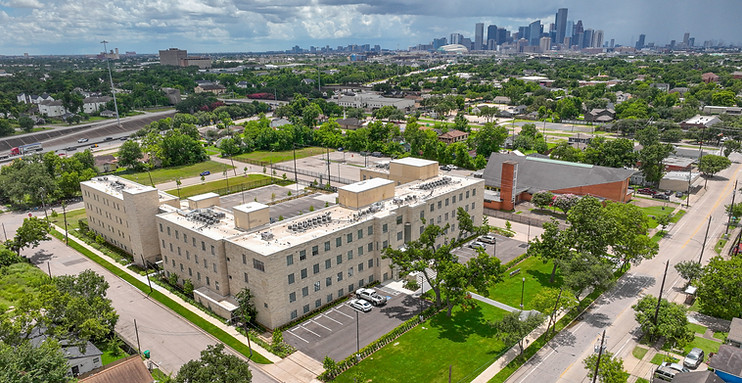 Aerial drone view of St. Elizabeth Place and its surrounding property, showing the building's layout within the Fifth Ward bl