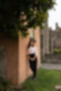 Leaning on peach wall.jpg