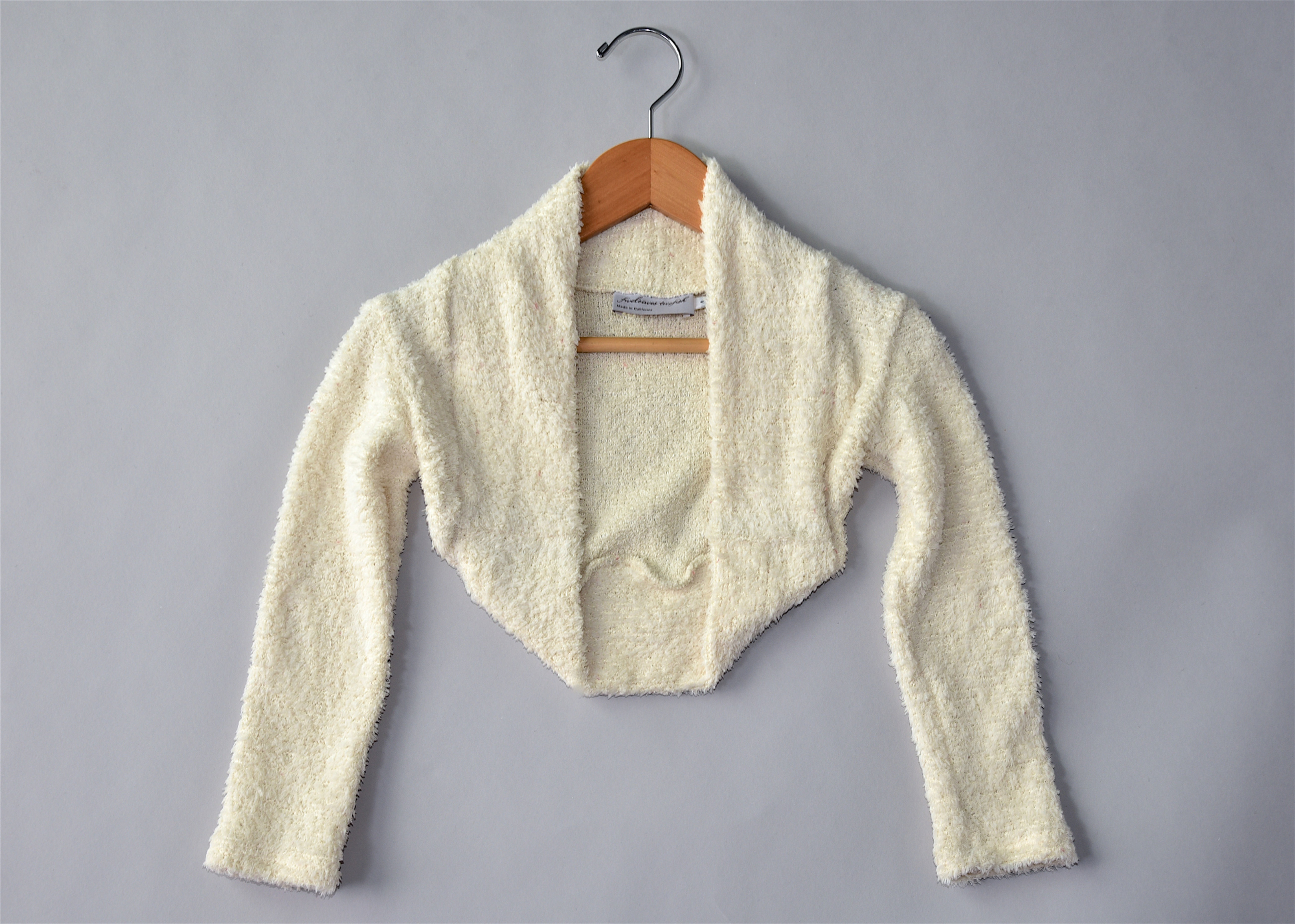 Front view of ivory buccle knit Bolero Sweater by 5L2F