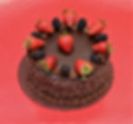 Chocolate Cake Topped with Strawberries and Blackberries
