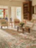 a living room with William Morris rug