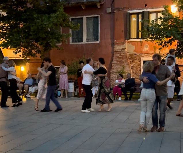 Dancing in a piazza in Venice Italy