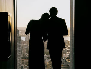 couple overlooking view of NYC from Riff Raff bar on romantic date
