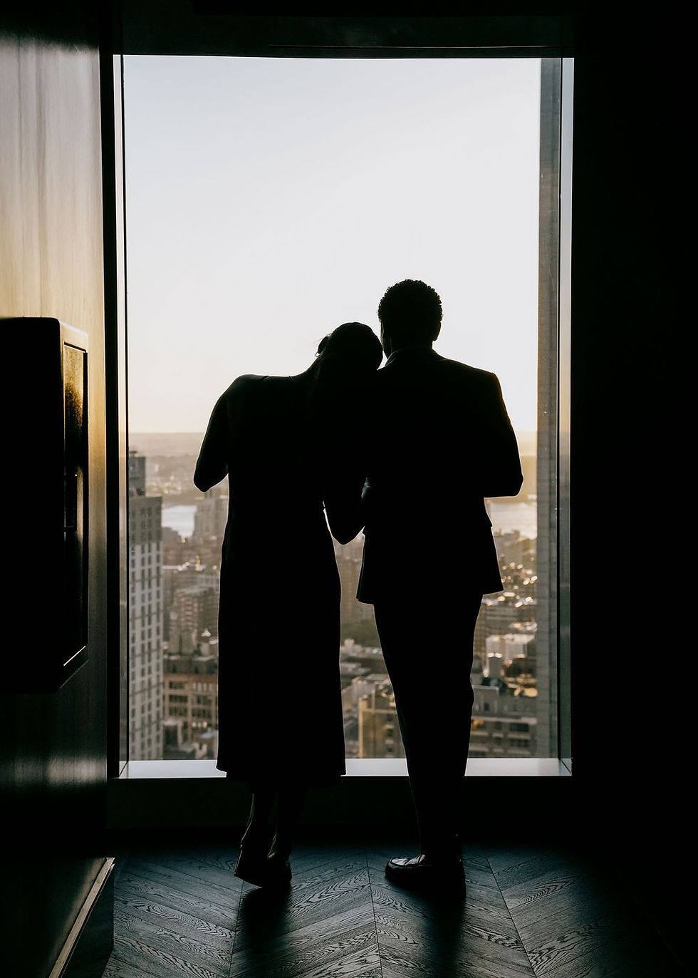 couple overlooking view of NYC from Riff Raff bar on romantic date