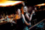 two women dancing whilst drinking cocktails at DJ event in NYC