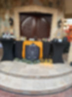 Outdoor wedding bar decor and aesthetics with wine bottles.