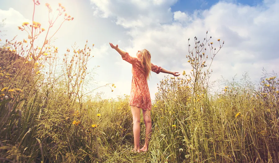 girl standing in a field