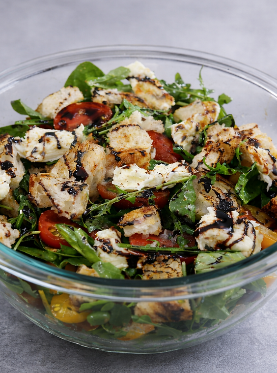 Tomato, basil and bocconcini salad with mixed leaves and a balsamic drizzle