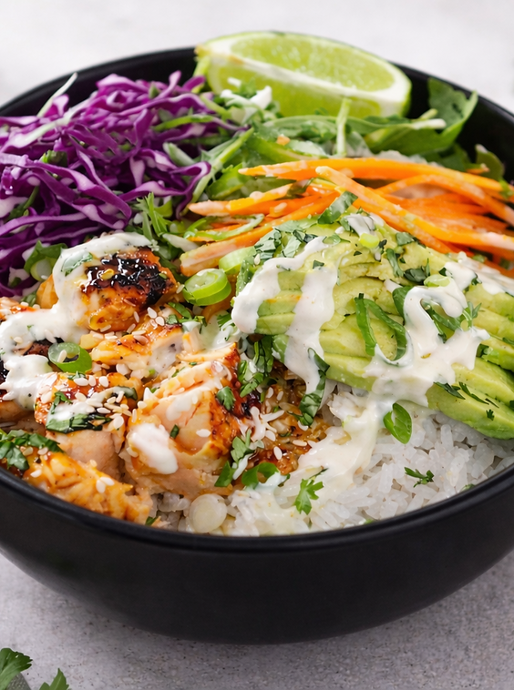 Sweet chilli lime salmon bowl with rice, avocado, red cabbage, carrot and creamy dressing