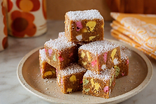 Multi-Coloured Fudge Cake no-bake slice with Explorer lollies and coconut, recreated from a 1979 hospital ward cookbook.