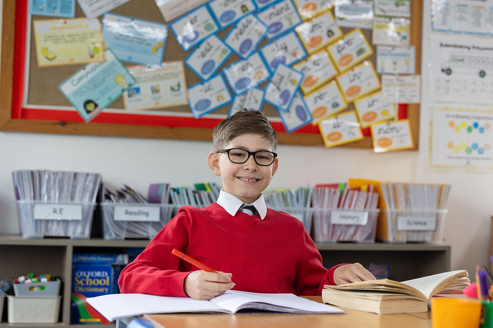 A happy child reading a book.