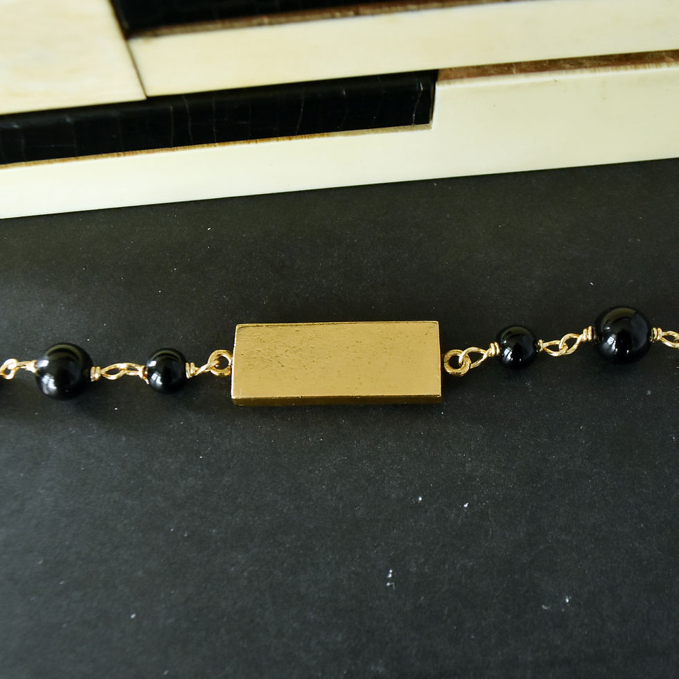 Thumbnail: Handmade piano jewelry bracelet featuring upcycled piano key and natural onyx beads
