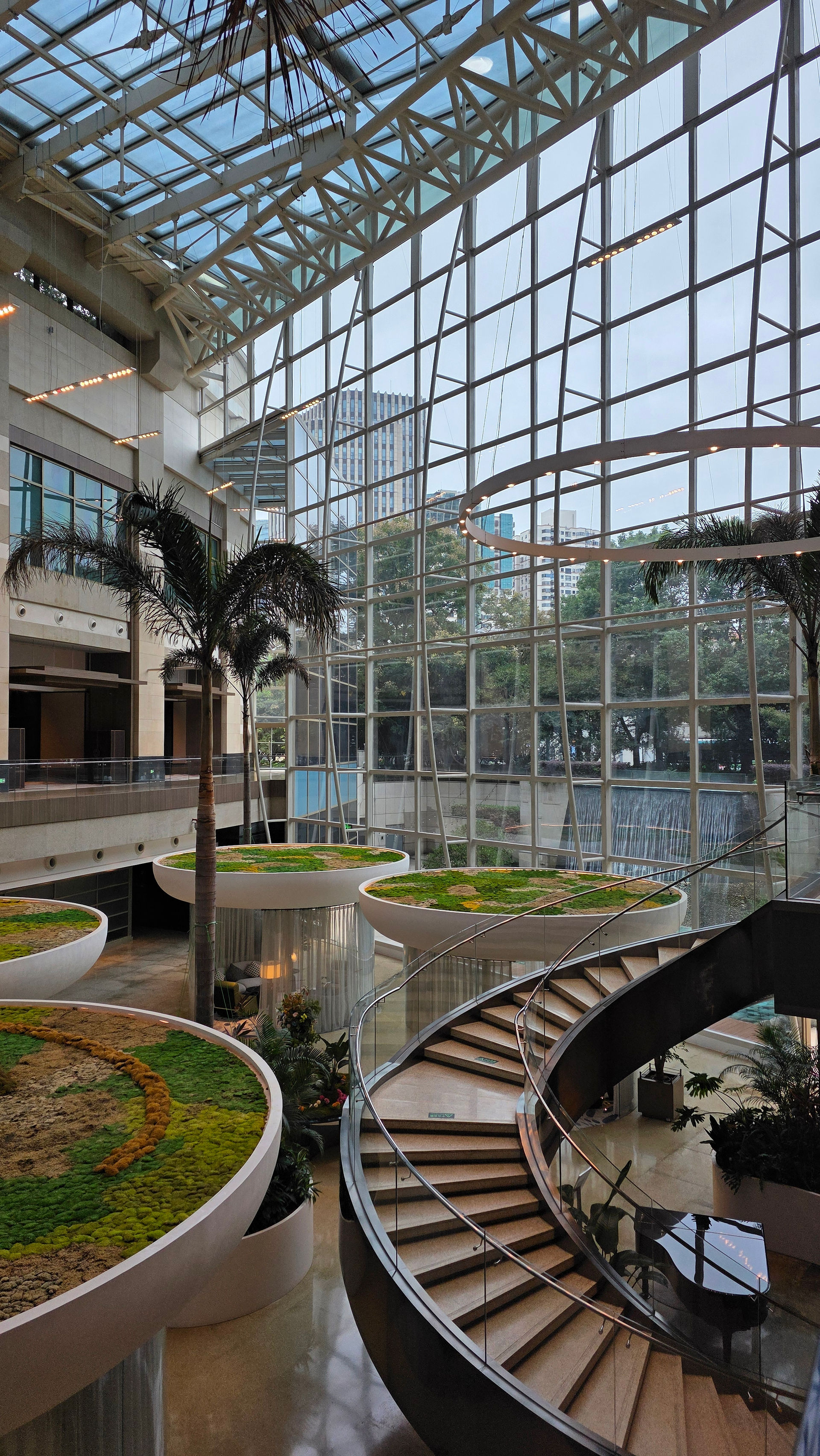 Where curved staircases meet sky-high glass.