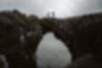 Standing on a cliff bridge in Iceland