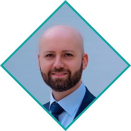 Federico Dellafiore wearing a suit and tie, smiling in a diamond-shaped blue frame with a light blue background.