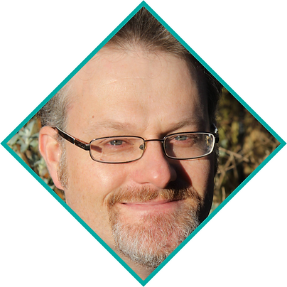 Steve Osborn outdoors, wearing glasses, with a mustache and beard, in a diamond-shaped frame. Sunlit background with greenery.