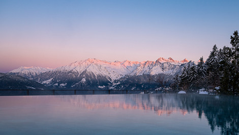 Dolomites panorama at dusk viewed from Chalet Mirabell spa terrace