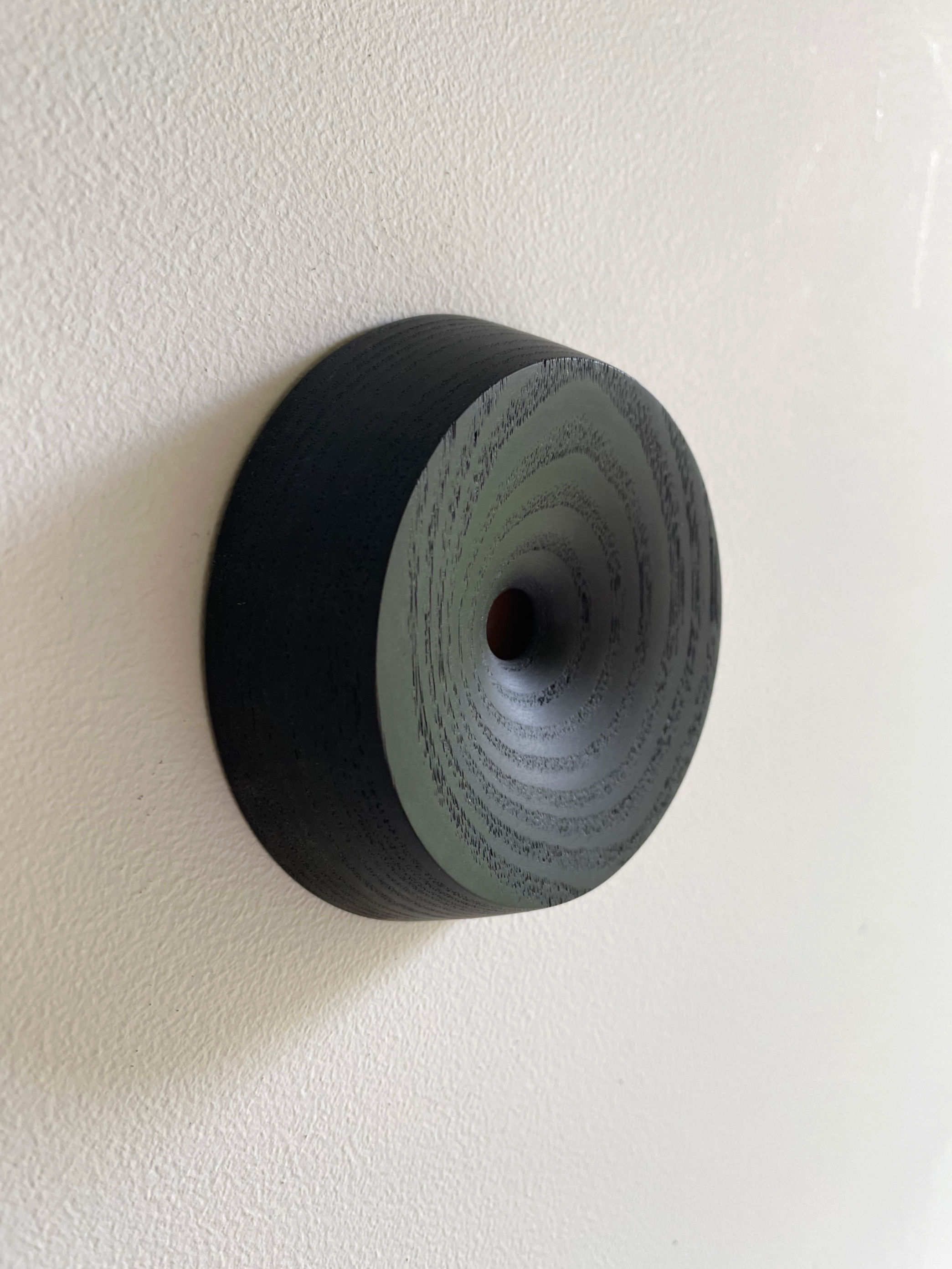 Black wall object 'why'