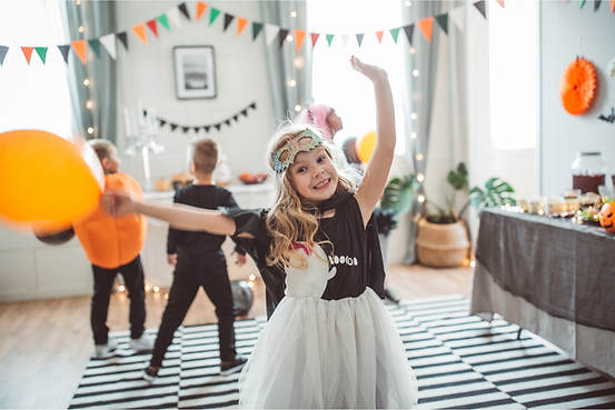 ABA therapist supporting child with Halloween visual schedule — inclusive Halloween strategies