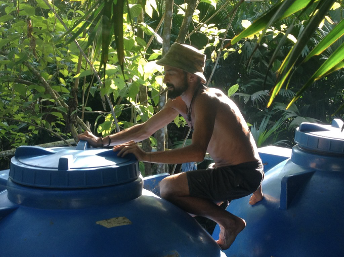Keric checking Punta Mona's Water Encatchment System