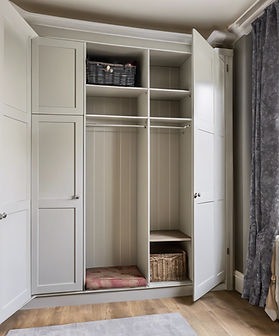 wardrobe with doors opened showing internal layout and storage