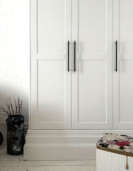Built-in IKEA PAX wardrobe close up, white painted