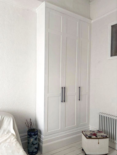 Floor-to-picture-rail built-in PAX wardrobe with 2.8-metre shaker doors, Brunswick apartment, Brighton — 4-metre ceiling height with original cornice moulding