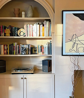 IKEA BILLY bookcase in alcove painted in a sandy light pink color