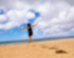 Making footprints in the sand on the beach. Walk your own path!