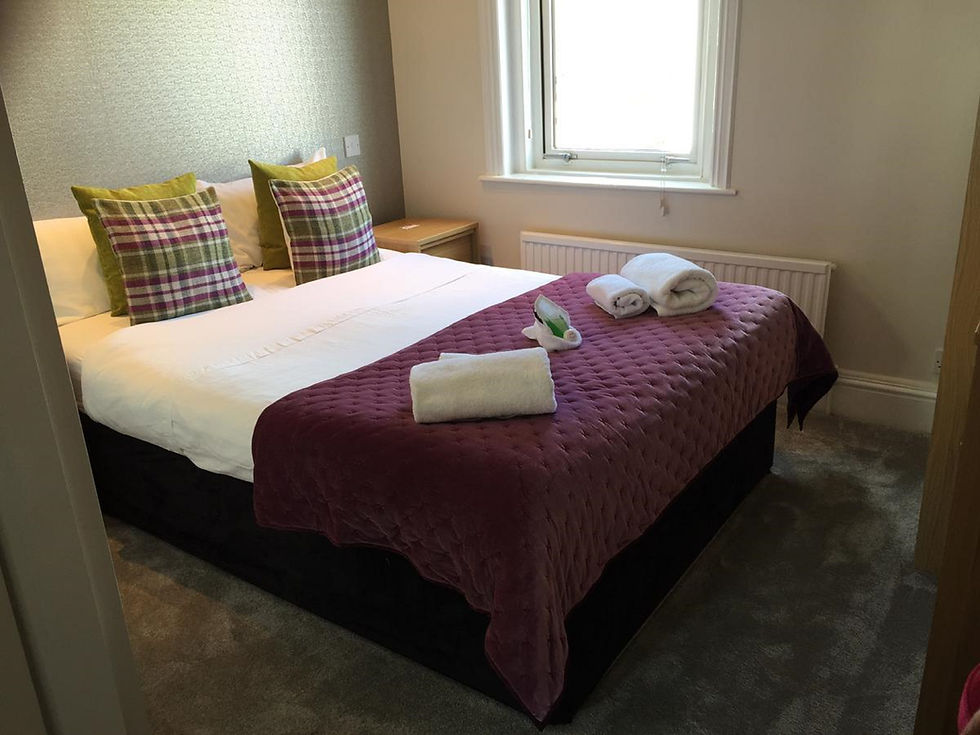 Modern bedroom in a dog friendly accommodation with double bed.