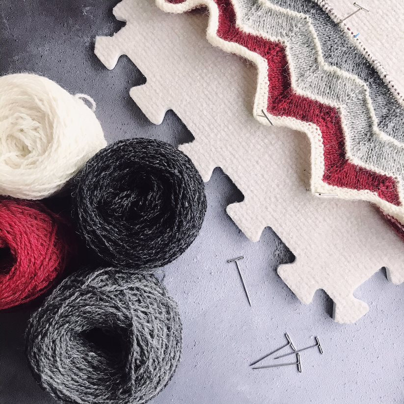Knitting and yarn on a foam board