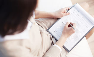 Woman completing a handwritten form