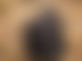 Brussels Griffon dog with scruffy beard and large dark eyes, resembling an Ewok