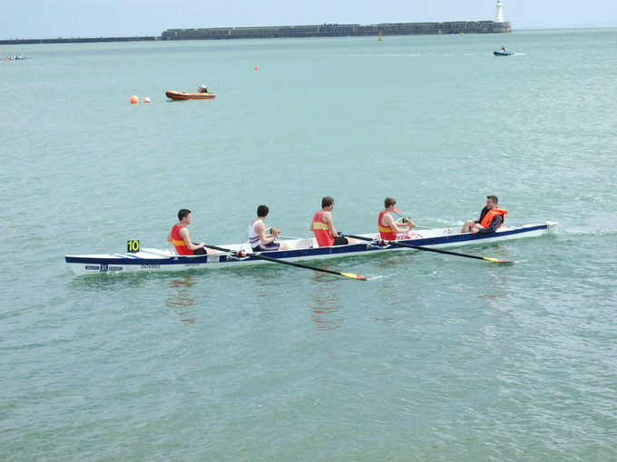 Jake, Jason, Harry, Adam with cox Ben Howell returning after their race