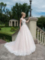 Bride in an Elena Morar wedding dress on a stairway