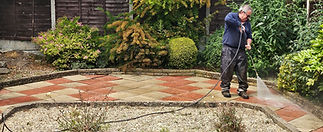 Patio slabs being power washed