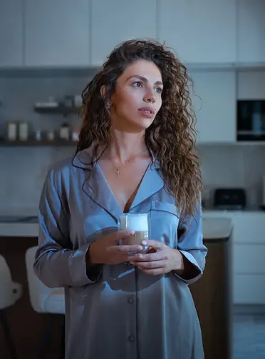 young-woman-pajamas-having-coffee-modern-kitchen-stylish-home.webp
