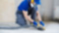 concrete floor surface grinding by angle grinder machine.jpg