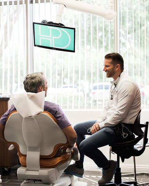 Dr Hales with a patient.jpeg