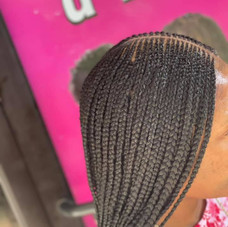 This is an alt text of center parted microbraids.
