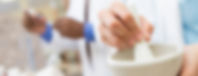 Pharmacist using compounding lab mortar and pestle