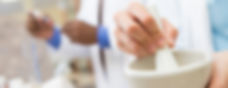 Pharmacist using compounding lab mortar and pestle